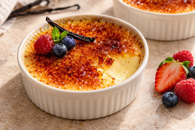 Berry Vanilla Crème Brûlée in a ramekin with a caramelized sugar crust