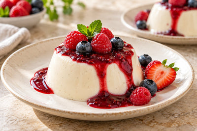 Dairy-Free Berry Vanilla Panna Cotta, unmolded on a plate with vanilla beans