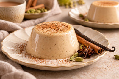 Dairy-Free Chai Vanilla Panna Cotta, unmolded on a plate with vanilla beans