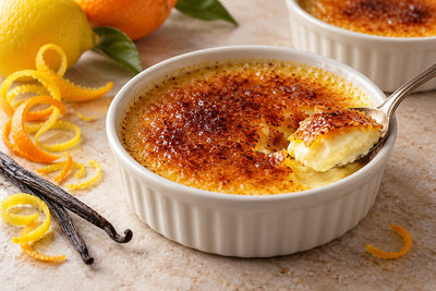 Dairy-Free Citrus Vanilla Crème Brûlée in a ramekin with a caramelized sugar crust