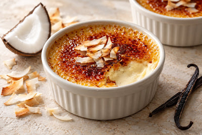 Dairy-Free Coconut Vanilla Crème Brûlée in a ramekin with a caramelized sugar crust