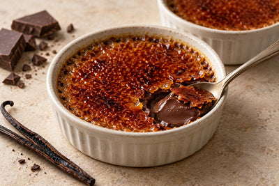 Dairy-Free Dark Chocolate Vanilla Crème Brûlée in a ramekin with a caramelized sugar crust