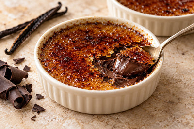 Dark Chocolate Vanilla Crème Brûlée in a ramekin with a caramelized sugar crust