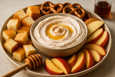 Bowl of honey cinnamon ricotta dip with brioche, pretzels and fruit