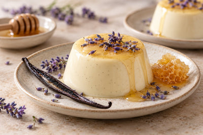 Honey Lavender Vanilla Panna Cotta, unmolded on a plate with vanilla beans