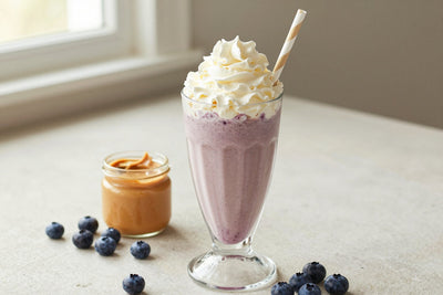 Peanut Butter Blueberry Milkshake in a glass