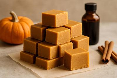 Squares of pumpkin spice fudge on parchment