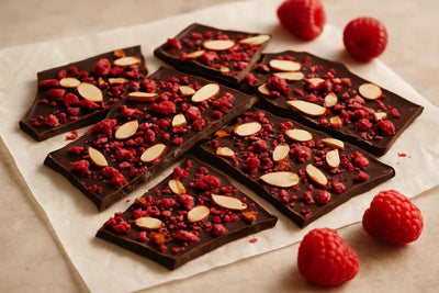 Shards of raspberry almond bark on parchment