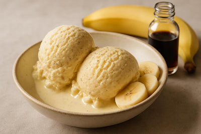 Scoops of vanilla banana cardamom custard ice cream in a ceramic bowl