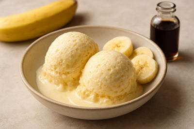 Scoops of vanilla banana custard ice cream in a ceramic bowl