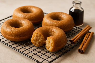 Vanilla Cinnamon Maple Cake Doughnuts on a cooling rack