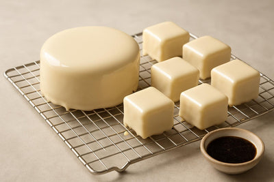 Cake coated in glossy vanilla mirror icing