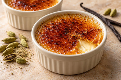 Vegan Cardamom Vanilla Crème Brûlée in a ramekin with a caramelized sugar crust