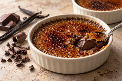 Vegan Dark Chocolate Vanilla Crème Brûlée in a ramekin with a caramelized sugar crust