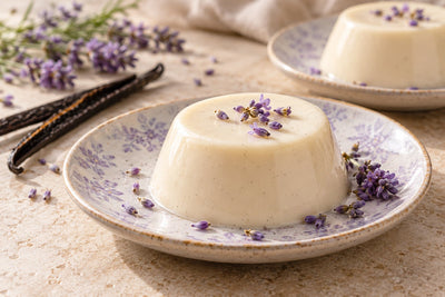 Vegan Lavender Vanilla Panna Cotta, unmolded on a plate with vanilla beans