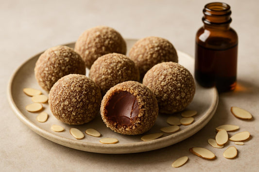 Almond Truffles on a plate, one bitten