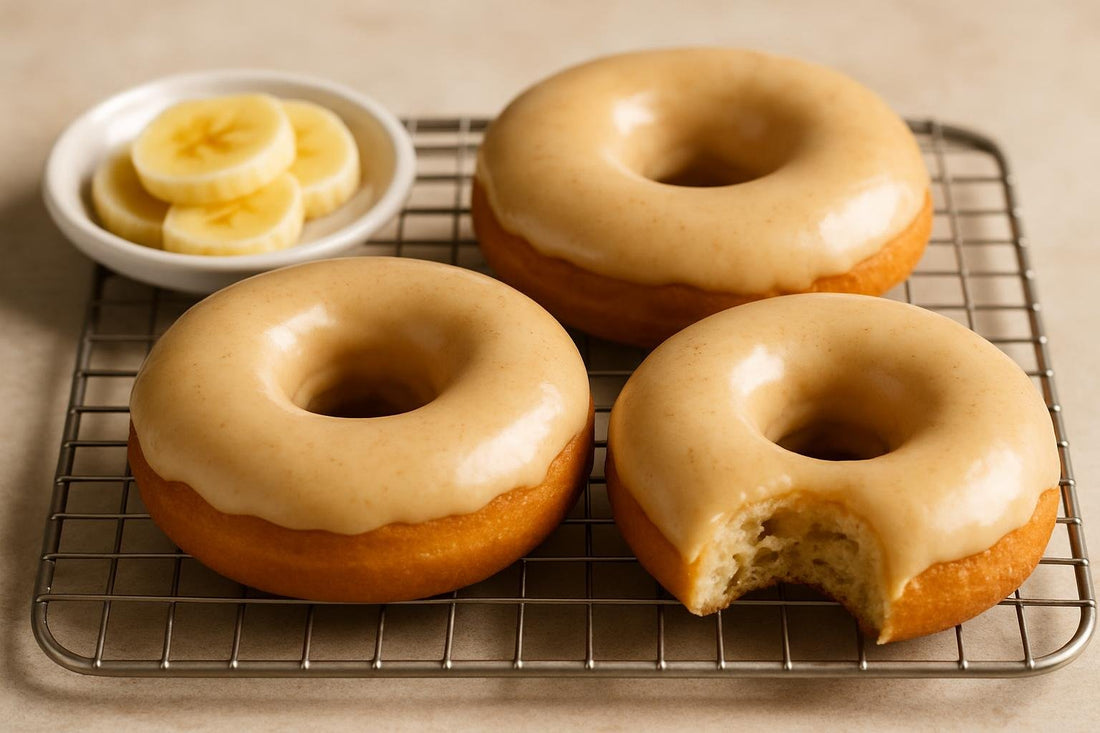 Doughnuts finished with banana glaze on a cooling rack