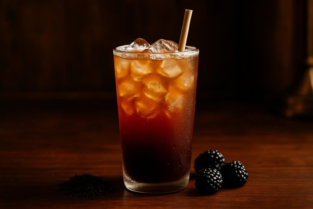Blackberry Iced Tea in a glass on an oak bar