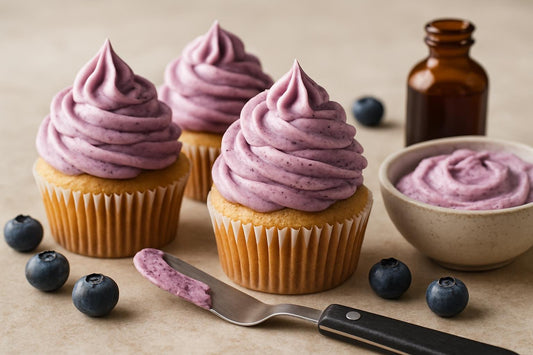 Cupcakes piped with blueberry cream cheese frosting