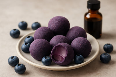 Blueberry Truffles on a plate, one bitten