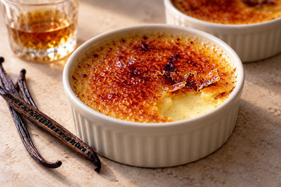 Bourbon Vanilla Crème Brûlée in a ramekin with a caramelized sugar crust
