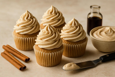 Cupcakes piped with cinnamon cream cheese frosting