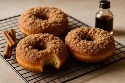 Doughnuts finished with cinnamon streusel on a cooling rack