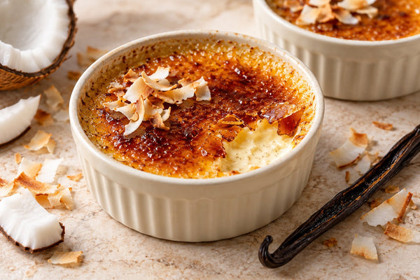 Coconut Vanilla Crème Brûlée in a ramekin with a caramelized sugar crust