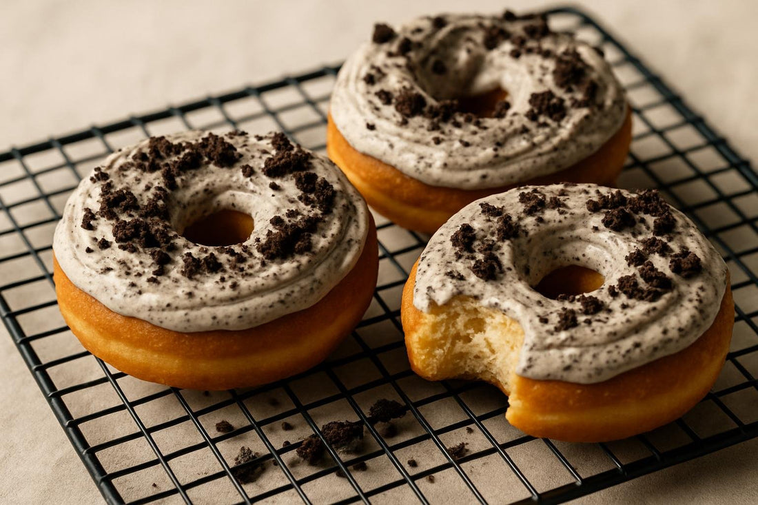 Doughnuts finished with cookies and cream frosting on a cooling rack