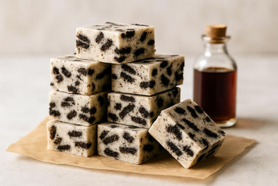 Squares of cookies and cream fudge on parchment