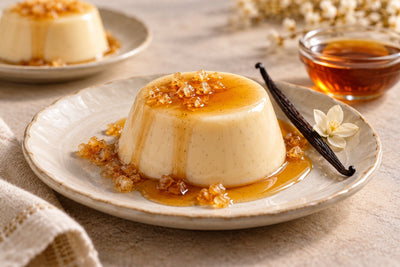 Dairy-Free Maple Vanilla Panna Cotta, unmolded on a plate with vanilla beans