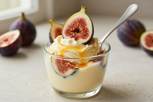 A generous swirl of fig gelato in a small glass cup with a flat gelato spade