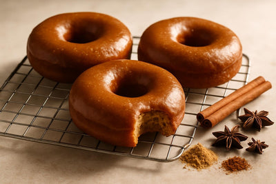 Doughnuts finished with gingerbread glaze on a cooling rack