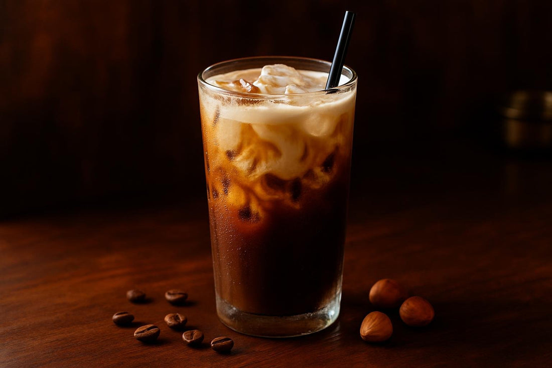 Hazelnut Cold Brew in a glass on an oak bar
