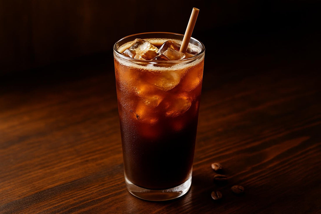 Iced Americano in a glass on an oak bar