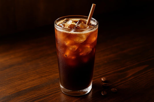 Iced Americano in a glass on an oak bar