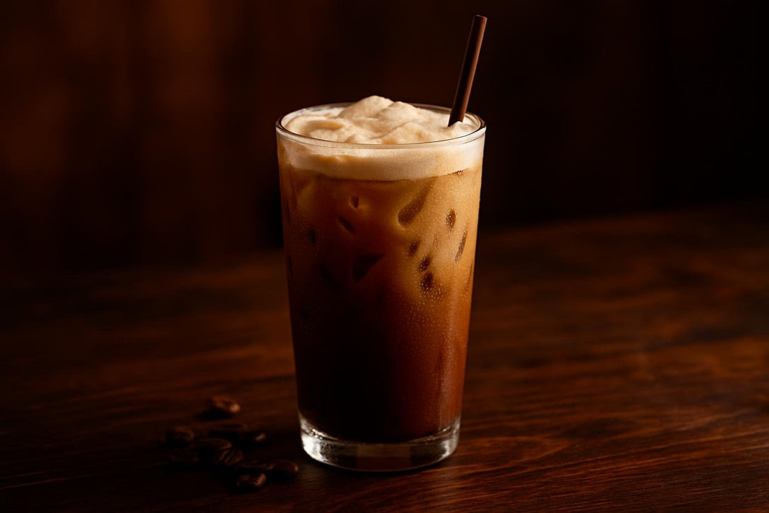 Iced Breve in a glass on an oak bar
