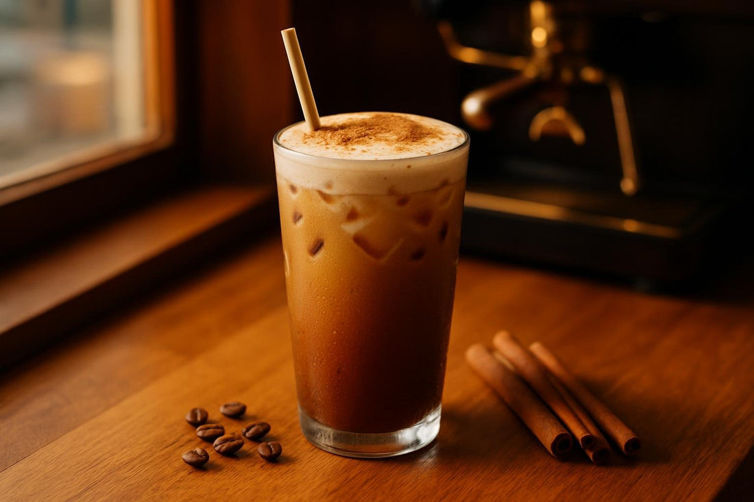 Iced Cinnamon Latte in a glass on an oak café counter