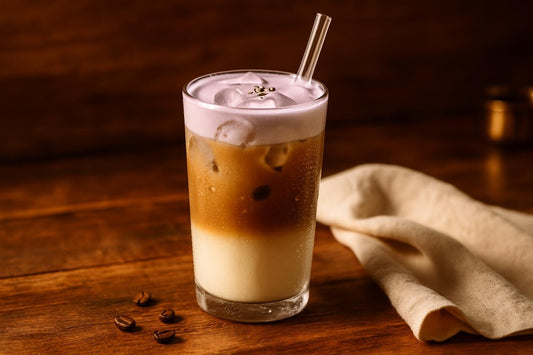 Iced Lavender Latte in a glass on an oak table