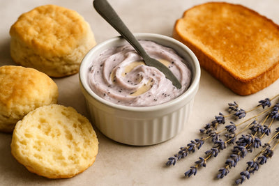 Lavender Honey Butter in a crock with warm biscuits