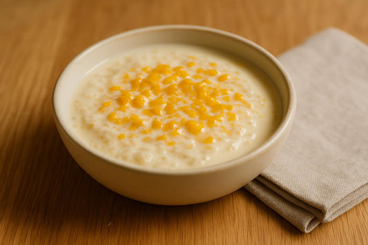 Mango Coconut Rice Pudding served on an oak table