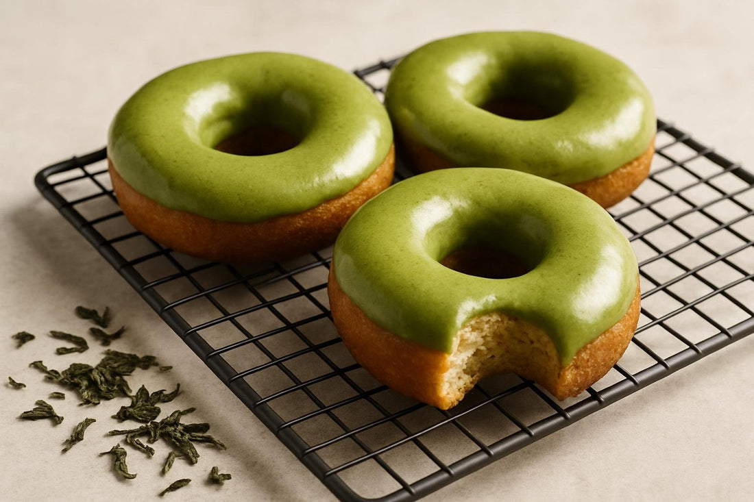 Doughnuts finished with matcha glaze on a cooling rack