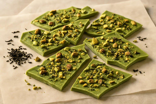 Shards of matcha pistachio bark on parchment