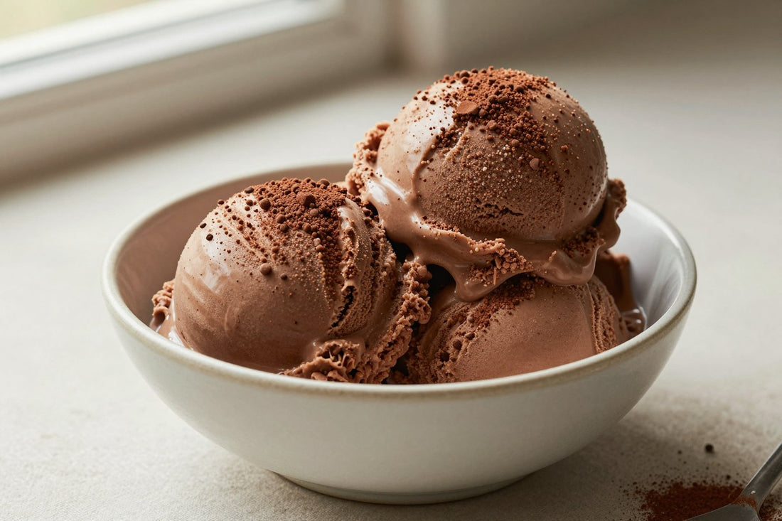 Two generous scoops of mocha ice cream in a shallow ceramic bowl, softly melting at the edges