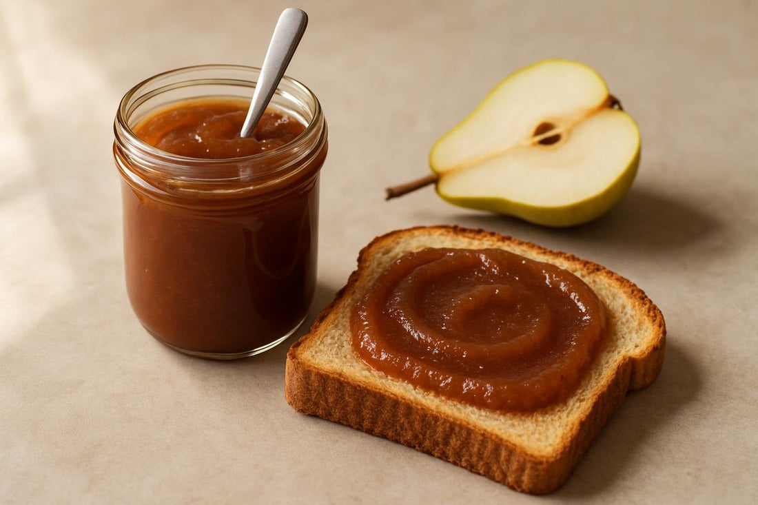 Jar of pear butter spread with toast