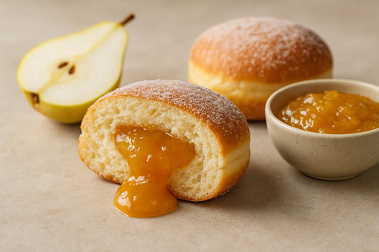 Filled doughnut cut open to show pear jam filling