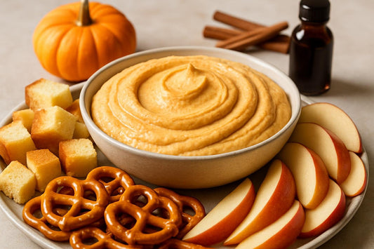 Bowl of pumpkin cheesecake dip with brioche, pretzels and fruit