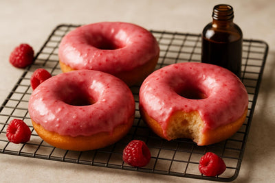 Doughnuts finished with raspberry glaze on a cooling rack