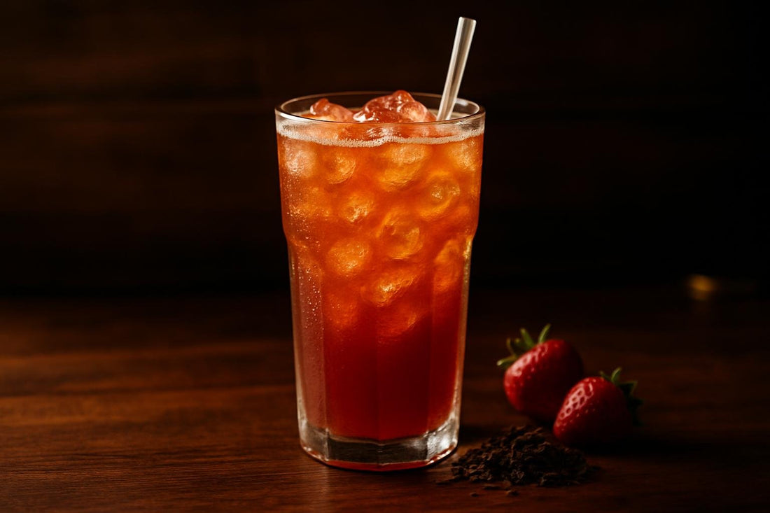 Strawberry Iced Tea in a glass on an oak bar