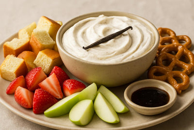 Bowl of Tahitian vanilla bean dip with brioche, pretzels and fruit